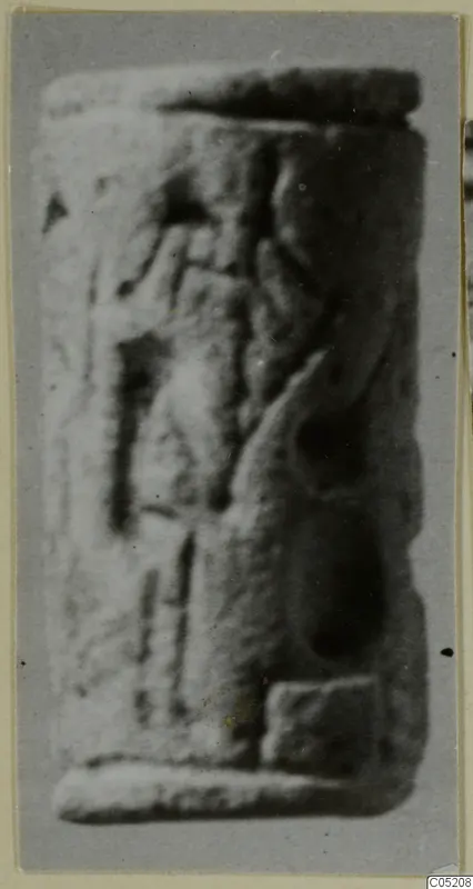 Cylinder seal from Enkomi, side view with carved motifs, photographed out of focus
