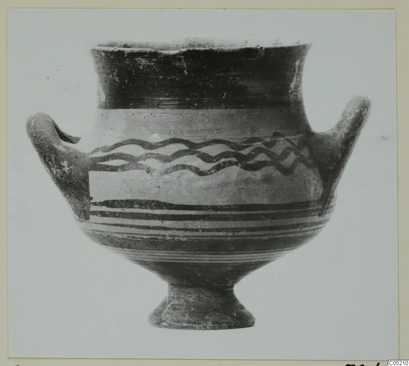 Pottery Bichrome I amphoriskos from the Lapithos Kastros tombs, a two-handled vessel with wavy painted bands