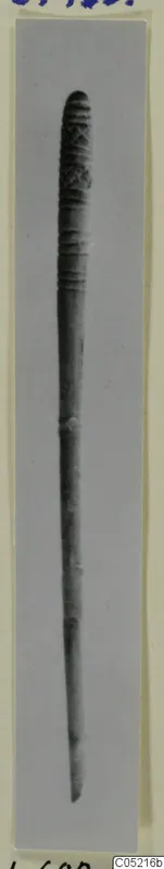 Bone pin with a ribbed and incised decorated head, photographed upright from Lapithos