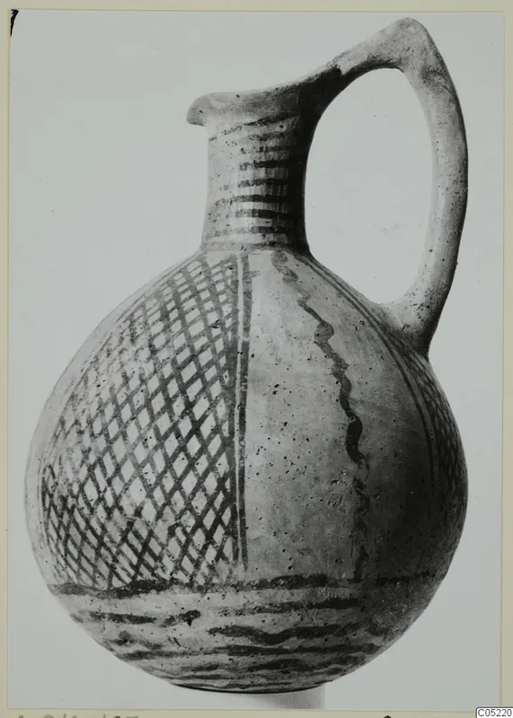 White Painted III-2 jug with a strap handle and dark painted lattice and band decoration, from Lapithos