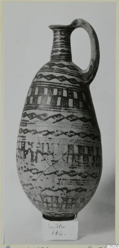 White Painted III-2 jug from Lapithos, with dark painted bands, wavy lines and checkered panels