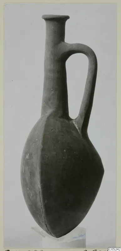 Pottery vessel with a tall neck, flared rim and single loop handle, from Enkomi