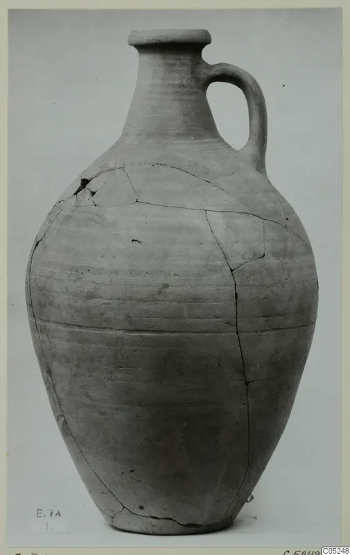 Plain pale wheel-made jug with a single loop handle, from Enkomi