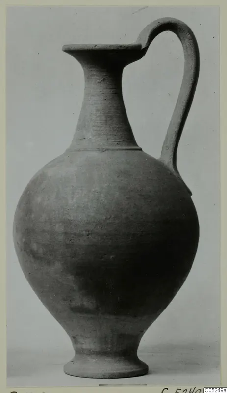 Plain White Wheel-made jug from Enkomi with a single loop handle, shown against a plain grey background