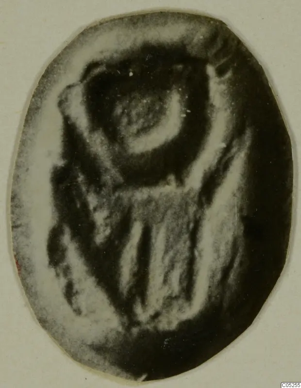 Oval glyptic object, a seal or gem with an engraved design, shown against a pale background