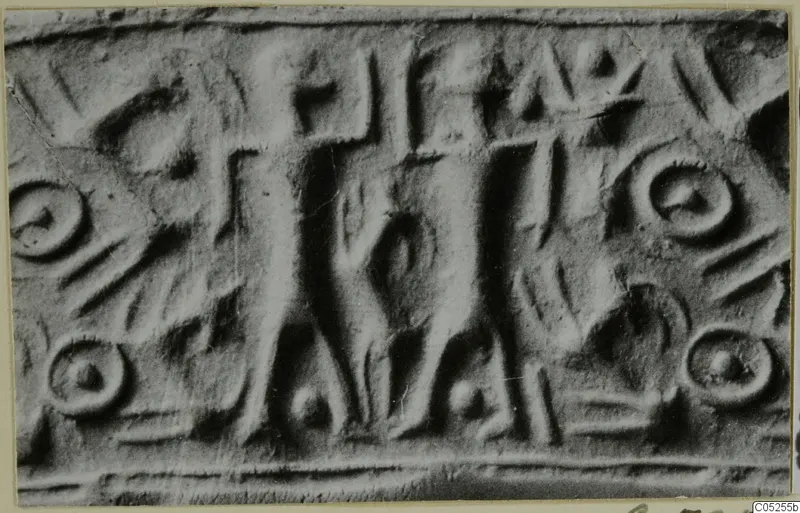 Enlarged photograph of a rolled impression of a cylinder seal, with a central upright figure and ring motifs
