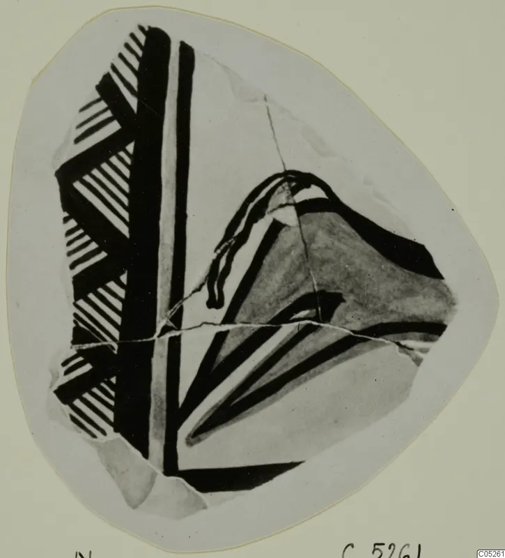 Pottery Bichrome Wheel-made sherd with black painted bands and hatched patterns, on a pale card