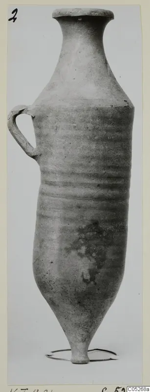 Cypro-Hell. I jug with a long neck, single loop handle and pointed base, standing on a wire ring