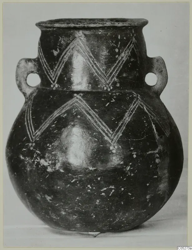 Round-bodied jug with two loop handles and white painted zigzag bands on a dark polished surface