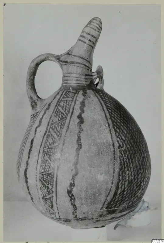White Painted I - II jug from the Vrysi tou Barba tombs at Lapithos, shown whole against a plain backdrop