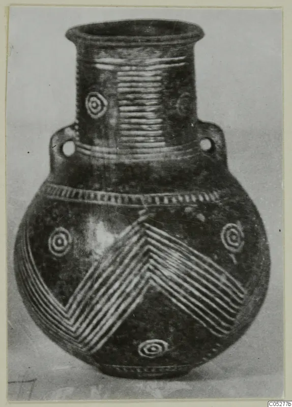 Red Polished III amphora from Lapithos with two perforated handles and chevron and spiral bands