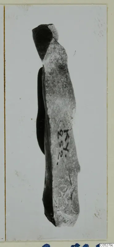 Elongated stone fragment from Kythrea, broken at the top, with a handwritten number label on its side.