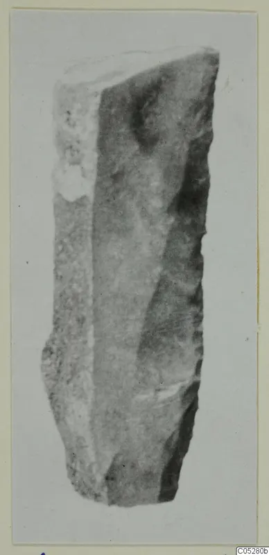 Stone knife from Kythrea, shown upright against a plain grey background