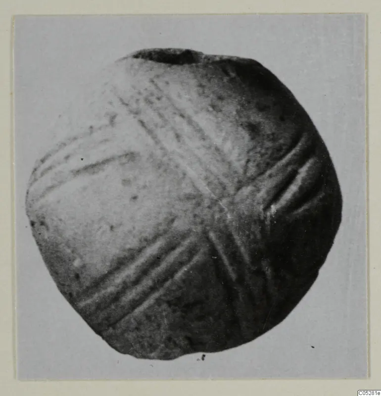 Round object with several sets of crossing incised grooves, a small find from Lapithos