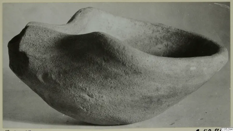 Terracotta lamp from Enkomi, shown from the side against a plain background