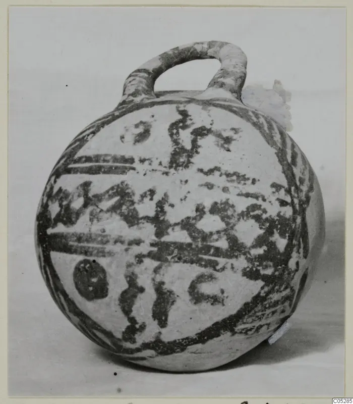 Round pottery vessel with a loop handle and dark painted bands, White Painted III-2, from Lapithos
