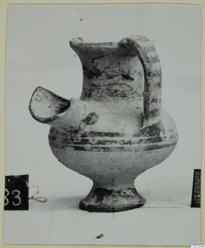 Pottery White Painted II spouted vessel from Lapithos, Kastros tombs, with a strap handle and painted bands