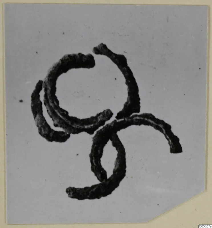Corroded bronze wire loops, jewellery from the Kastros tombs at Lapithos