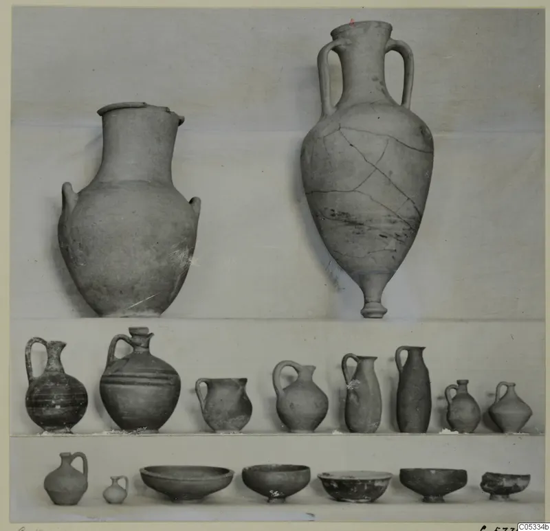 Pottery from Marion, Tomb 31: two large jars at top, a row of jugs and juglets in the middle, and bowls and small jugs along the bottom.