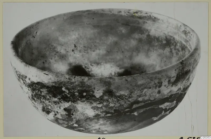Large shallow bowl of cast glass, photographed from above at an angle.