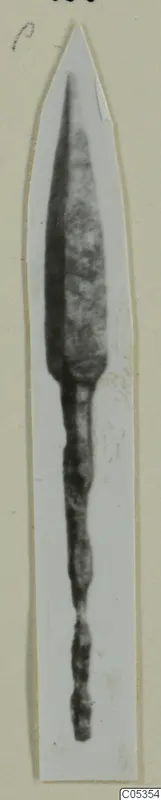 Bronze blade with a long tang, a find from Marion, shown on a card mount