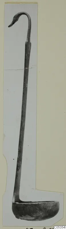 Bronze ladle with a long handle curled into a bird-like head, from Marion
