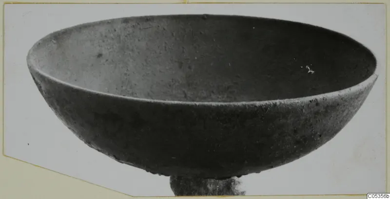 Bronze bowl from Marion Tomb 73, photographed at an angle from above.