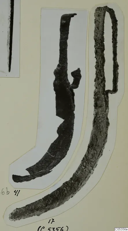Blade and handle from Marion: two corroded metal objects, cut out and mounted on a card.