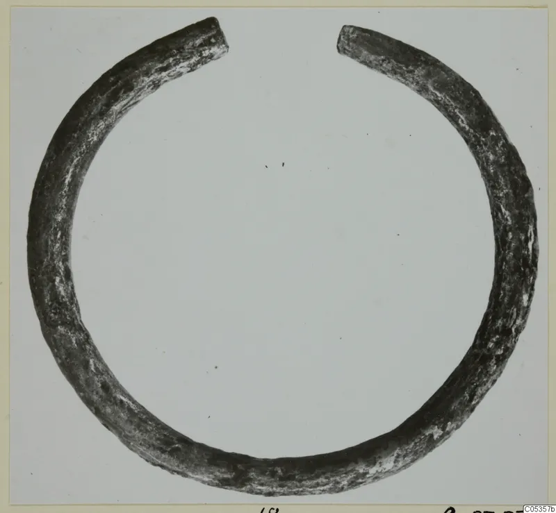 Open metal ring with tapering ends, from Marion, Tomb 62.