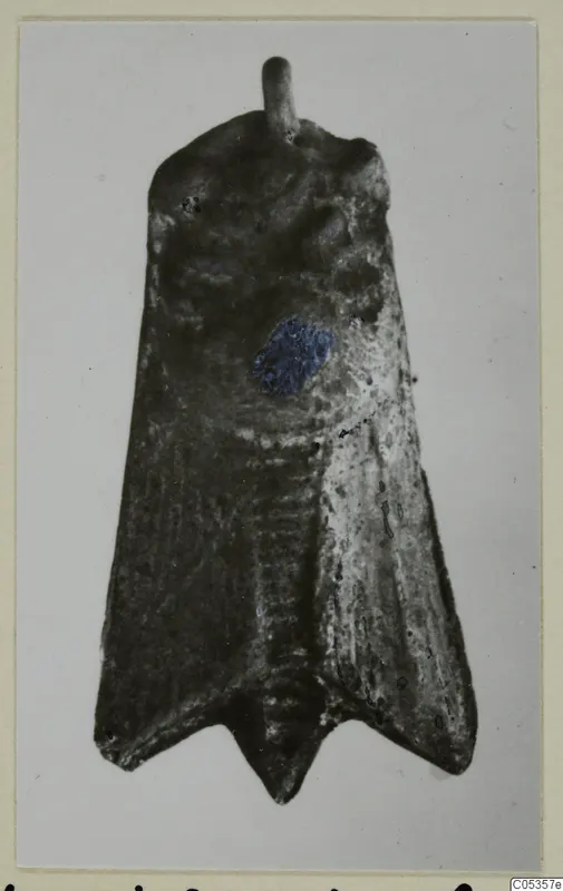Flat, dark metal object from Vouni with a short rod at the top and a forked lower end