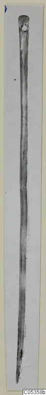 Long pin with a thickened, rounded head, shown upright against a pale background, from Vouni