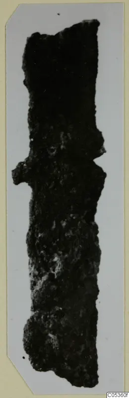 Corroded iron tool from Amathus, long and narrow, shown as a mounted photograph.