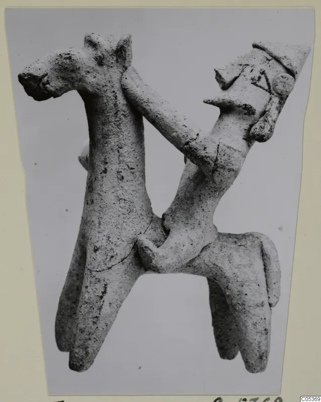 Clay figurine of a horse with a rider wearing a pointed cap, from Amathus tomb group 2-26