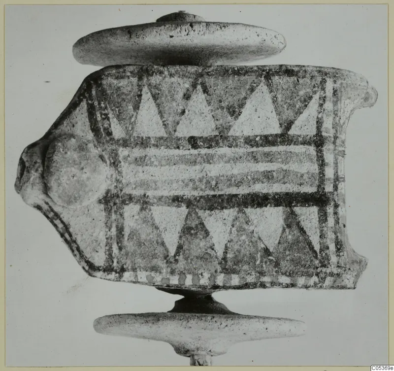 Painted terracotta object from Amathus with a head-like projection, shown on a stand