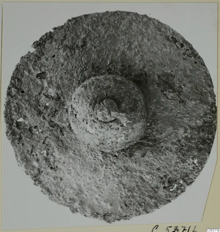 Round, flat find with a raised central boss, from Amathus