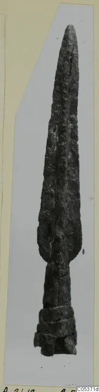 Bronze spearhead from Amathus, with a long leaf-shaped blade, a midrib and a socket at the base, corroded surface.
