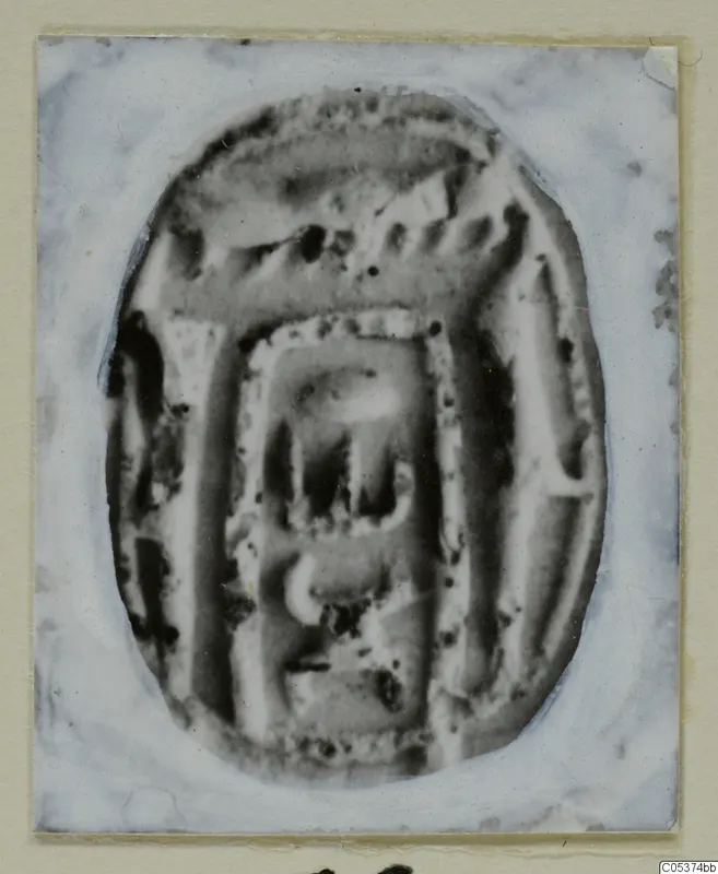 Oval seal or scarab with an incised design, photographed on a mounted card, from Amathus