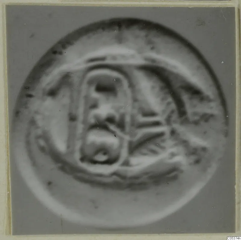 Glyptic: a round seal or gem with a raised rectangular motif and curved lines