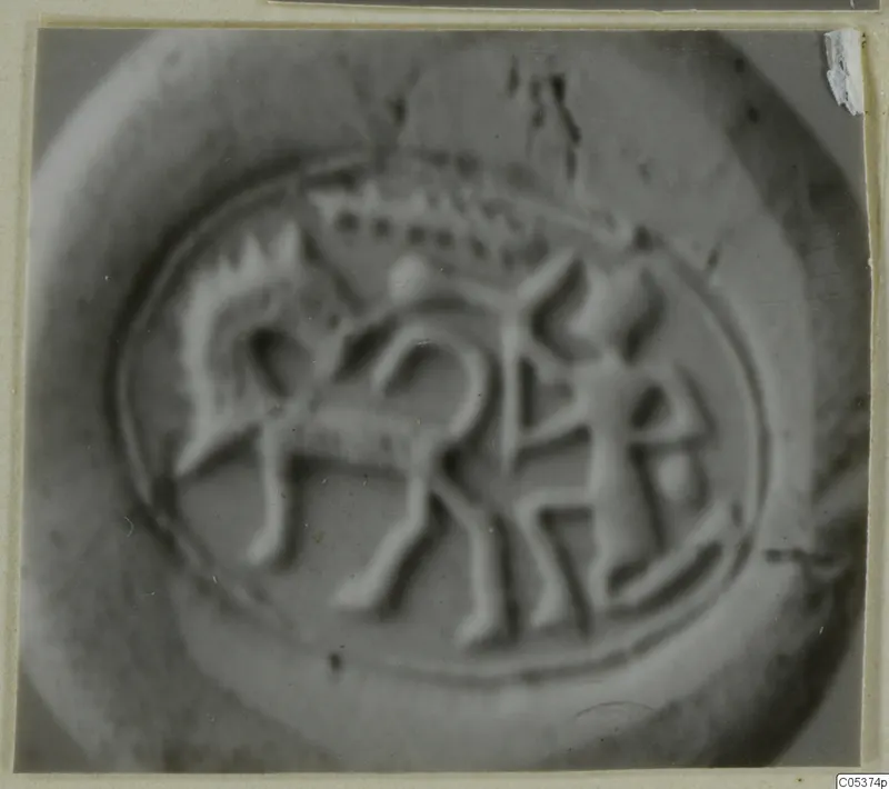 Engraved seal or gem showing an animal and a standing human figure within a circular border