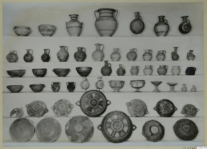 Pottery vessels from Amathus, Tomb 7, second burial, arranged in rows on white cloth