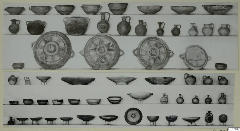 Pottery vessels from Amathus Tomb 7, third burial, arranged in rows on shelves.