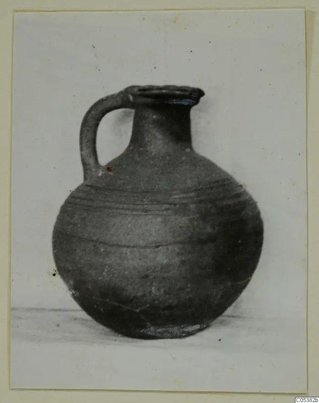 Round jug from Amathus, Tomb 20, with a single strap handle and horizontal bands around the body