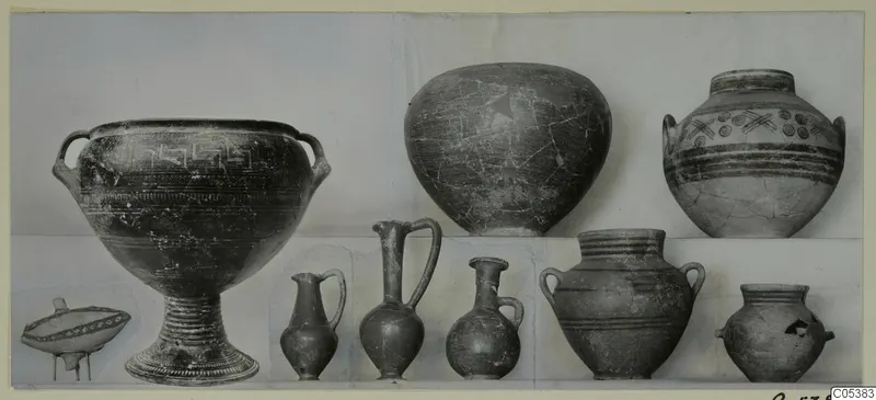 Pottery vessels from Amathus Tomb 12, photographed in two rows against a pale backdrop