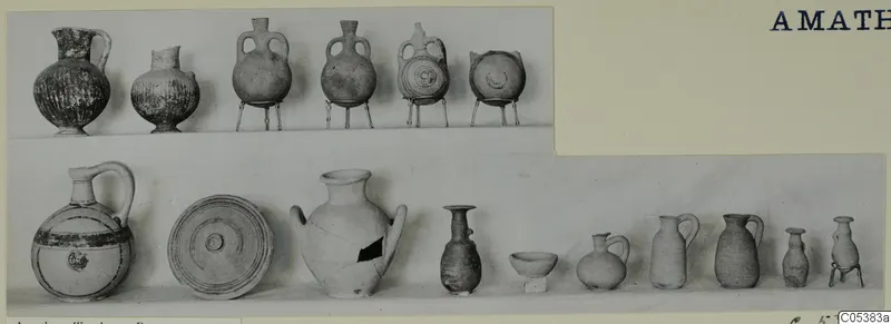 Pottery vessels from Amathus Tomb 25: two rows of jugs, jars and bowls against a pale background
