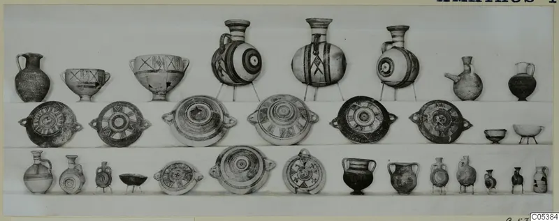 Pottery vessels from Amathus Tomb 19, about thirty pieces arranged in three rows