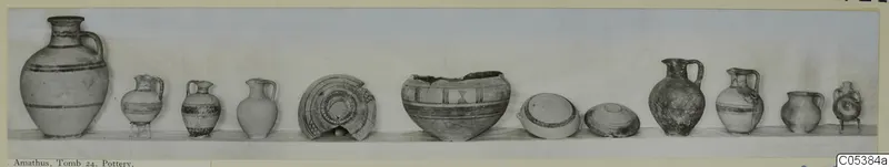 Row of about a dozen pottery vessels from Amathus, Tomb 24, set out along a shelf