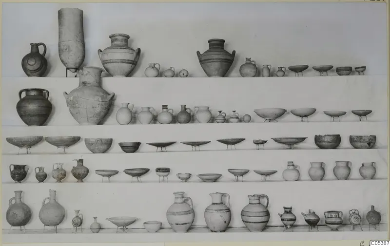 Pottery vessels from Amathus, Tomb 23, jugs, jars and bowls arranged in rows on shelves