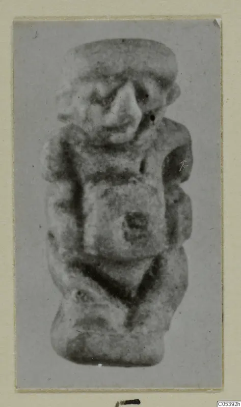 Small figurine from Amathus of a squat figure with a broad head, large nose and arms held against the body.