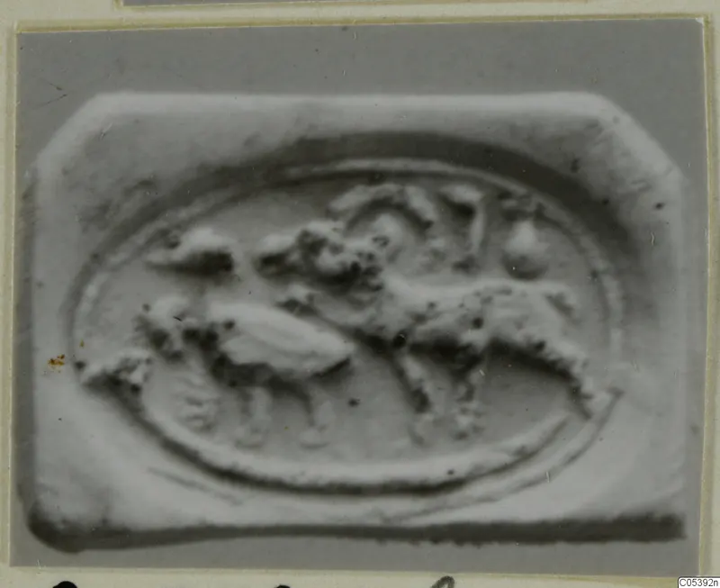 Glyptic scarab from Amathus, showing a raised oval scene with an animal and figures