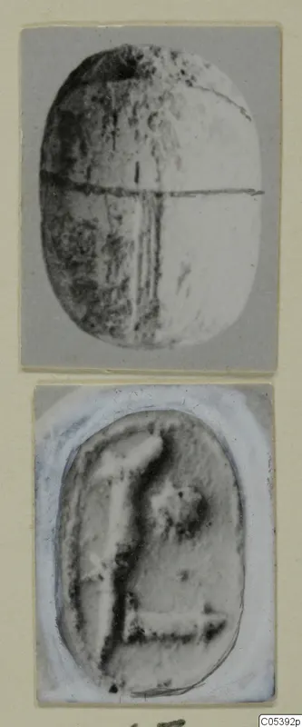 Two views of a scarab from Amathus: the back with a horizontal dividing line, and the carved base with a figure-like design